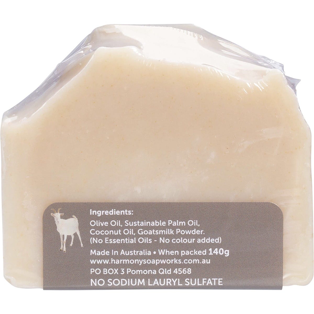 Unwrapped bar of Harmony Soapworks unscented goat's milk soap on a white background.