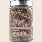 Back of a Kintra Blends Morning Bloom tea jar showing ingredients, brewing instructions, and a white floral label.
