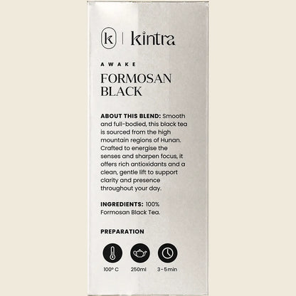 Side view of a Kintra Blends Formosan Black Tea bag showing a barcode and organic certification logo.