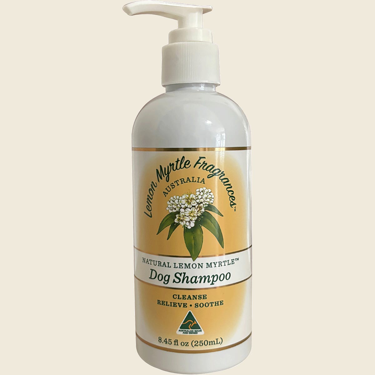 A 250ml bottle of Lemon Myrtle Fragrances Dog Shampoo with a green label featuring a dog and botanical illustrations.