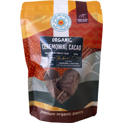 White pouch of Love My Earth Organic Ceremonial Cacao 225g with a red and orange heart-shaped logo.