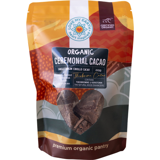 White pouch of Love My Earth Organic Ceremonial Cacao 225g with a red and orange heart-shaped logo.