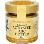 A jar of LiveWholefoods Organic Activated ABC Butter on a plain white background. The jar has a gold lid and a cream-colored label with brown text and illustrations of sprouted wheat.
