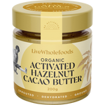 A jar of LiveWholefoods Organic Activated Hazelnut Cacao Butter on a plain white background. The packaging features a beige and gold label with black text, a gold lid, and a yellow seal.