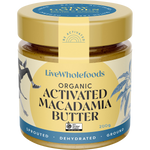A jar of LiveWholefoods Organic Activated Macadamia Butter on a plain white background. The jar has a gold lid and a cream-colored label with blue text and accents, featuring a 'Certified Global Organic Standards' logo.