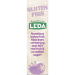 Close-up of a Leda Triple Berry fruit bar showing its golden-baked texture and rich dark berry filling.