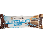 A packaged protein indulgence bar in a wrapper that reads 'macromike PROTEIN INDULGENCE BAR' and 'Cookies & Cream Flavour,' with chocolate splash graphics and a slice of the bar shown on the right side.