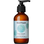 Mad Hippie Cream Cleanser in an amber glass bottle with a black pump dispenser and a light blue label, shown on a plain white background.