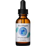 Mad Hippie Antioxidant Facial Oil in an amber glass dropper bottle with a white label and black cap, isolated on a white background.