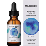 Mad Hippie Antioxidant Facial Oil in an amber glass dropper bottle next to its white packaging box, featuring a blue watercolor design.