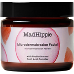 Mad Hippie Microdermbasation Facial jar in an amber glass bottle with a black lid and a white label featuring pink circular graphics.