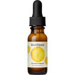 Mad Hippie Vitamin C Serum in an amber glass dropper bottle with a black cap and a cream label featuring a yellow citrus graphic.