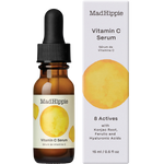 Mad Hippie Vitamin C Serum in an amber glass dropper bottle next to its white cardboard packaging box, both featuring a yellow watercolor circle graphic.