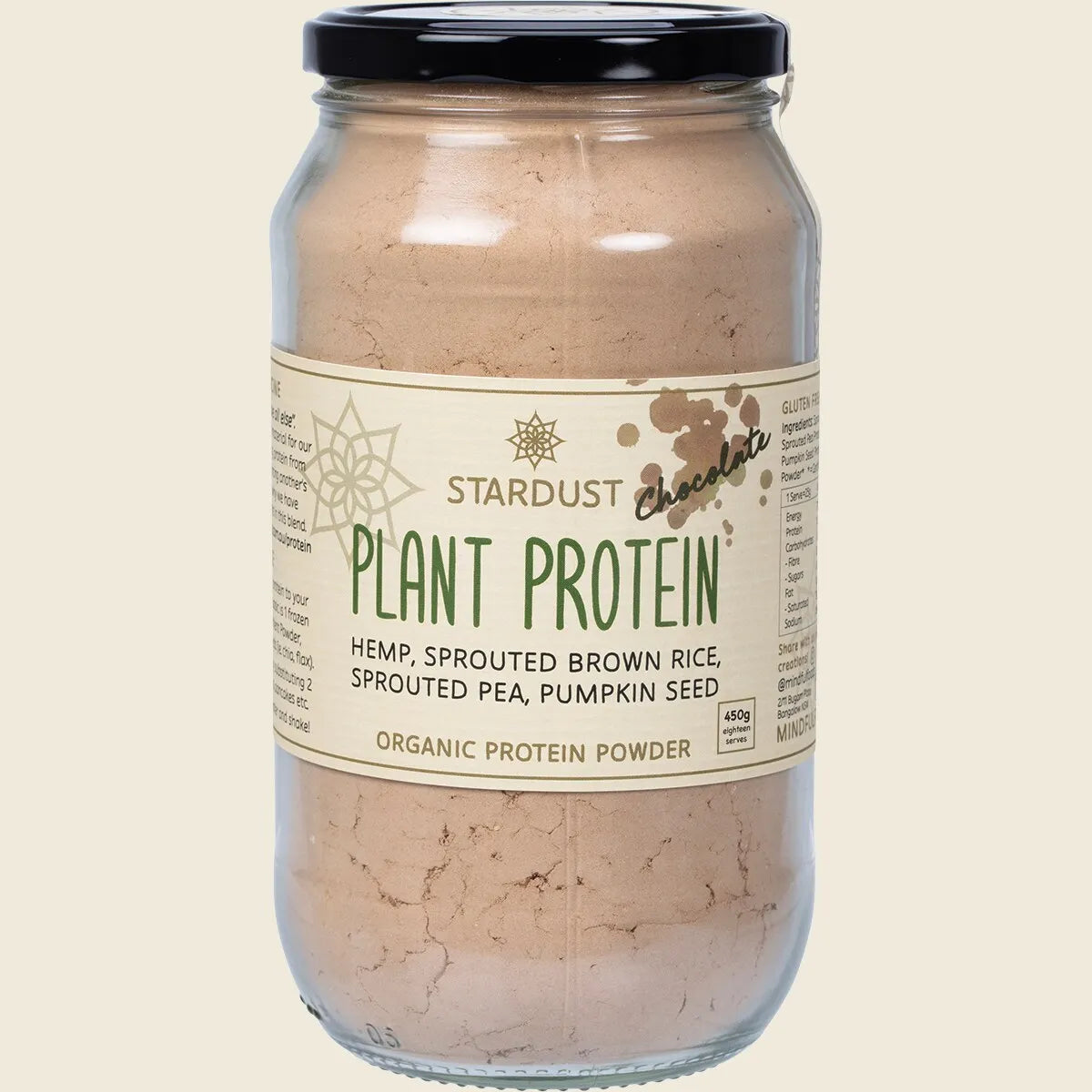 Mindful Foods Stardust Chocolate Plant Protein Powder in a 450g glass jar with a black lid and illustrated label.