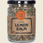 Mindful Foods Organic Lemon Balm 40g in a clear glass jar with a white and gold label and black lid.