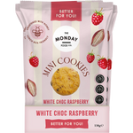 Retail display box filled with several white and pink bags of The Monday Food Co. White Choc Raspberry Mini Cookies.