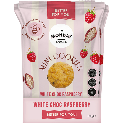 Retail display box filled with several white and pink bags of The Monday Food Co. White Choc Raspberry Mini Cookies.