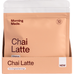 A white and orange display box for Morning Made Original Chai Latte containing 12 individual 50g sachets.