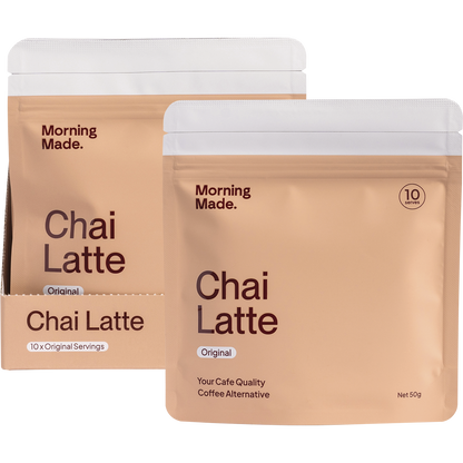 Morning Made Original Chai Latte 12x50g box next to a prepared cup of chai with a sachet and scattered spices.
