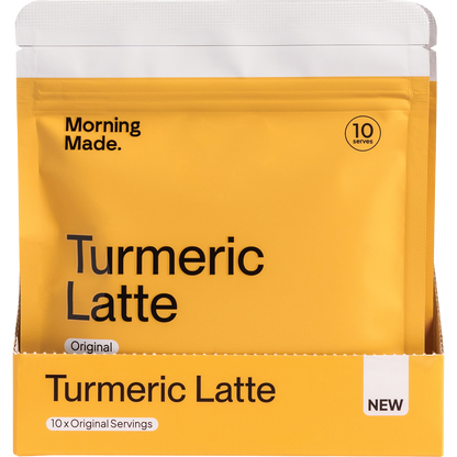 Front of a gold and white box for Morning Made Original Turmeric Latte featuring 12 sachets.