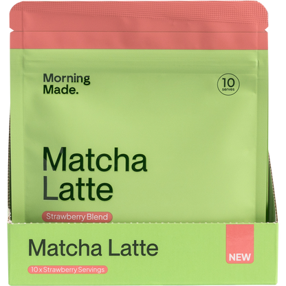 Pink and white display box containing 12 individual 50g sachets of Morning Made Strawberry Matcha Latte.