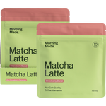 Pink 50g pouch of Morning Made Strawberry Matcha Latte next to a white box and a glass of the prepared iced drink.