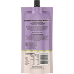 Back view of a purple and beige squeeze pouch with a black cap, showing product text, ingredients, nutrition facts, and a barcode on a white background.