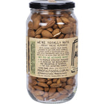 Close-up of a 450g jar of Mindful Foods Organic & Activated Almonds, showing the white label and crunchy whole nuts inside.