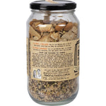 Mindful Foods 500g Birchia granola in a glass jar, showing ingredients like nuts and seeds on a white background.