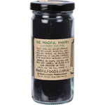 Back of Mindful Foods Organic Black Cumin 120g jar with nutrition facts, ingredients, and usage instructions.