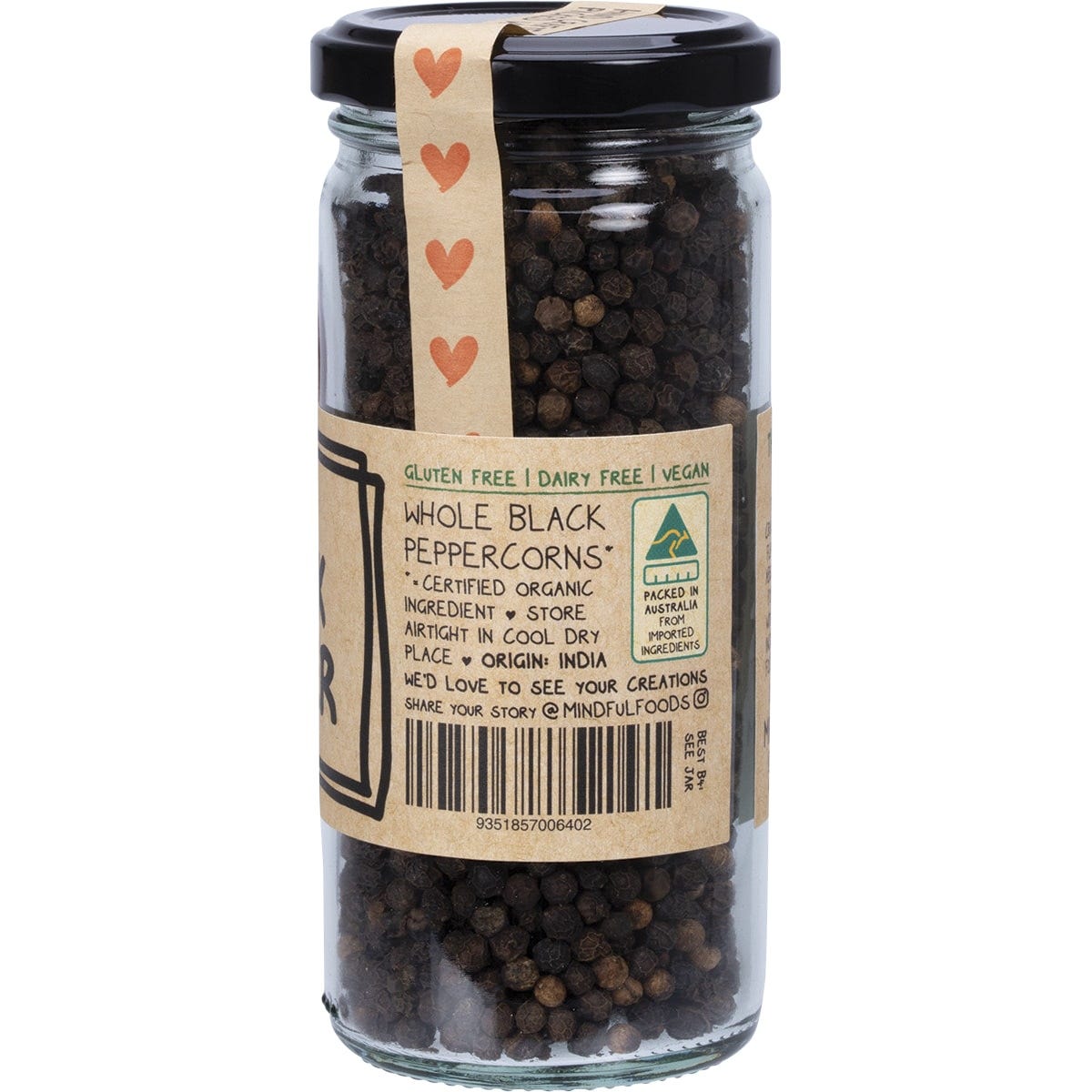 Side view of a Mindful Foods Organic Black Pepper 130g glass jar showing the organic certification and brand story.