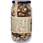 Side view of a Mindful Foods Organic & Activated Brazil Nuts 600g glass jar highlighting its blue and white label.