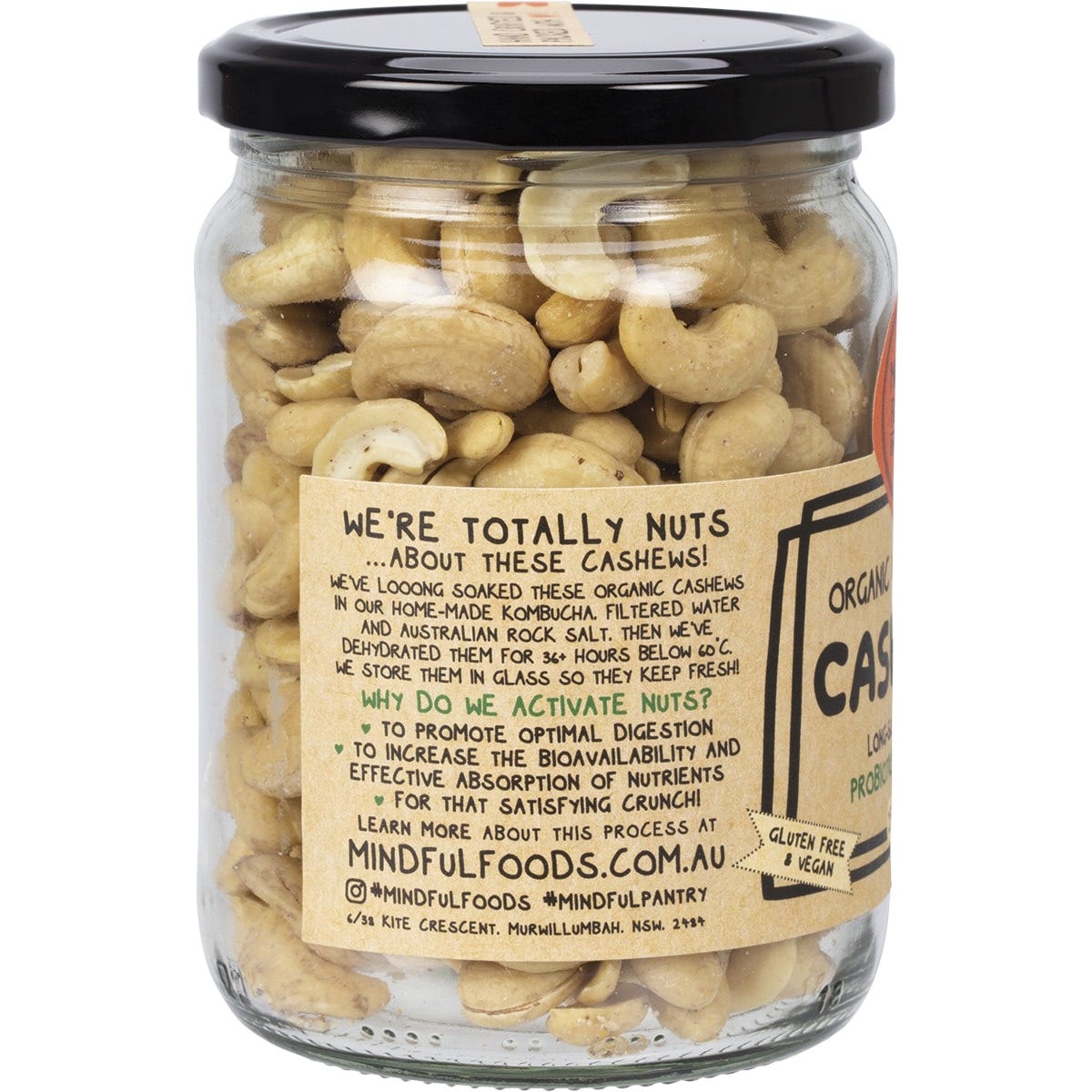 Mindful Foods 250g glass jar of organic and activated cashews with a white and gold label on a white background.