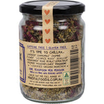 Close-up of Mindful Foods Chillax Brew 60g loose leaf tea blend with dried chamomile, lavender, and rose petals.