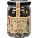 Loose leaf Mindful Foods Fire Starter Organic Herbal Tea with dried herbs, spices, and green tea leaves.
