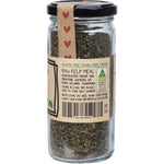 Side view of Mindful Foods Raw Tasmanian Kelp Meal 180g glass jar with a black lid and botanical label.