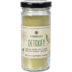 100g glass jar of Mindful Foods Stardust Detoxify Organic Nutrient Powder with a green label and matcha ingredients.