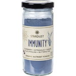 100g glass jar of Mindful Foods Stardust Immunity organic nutrient powder with a blue botanical label and metal lid.