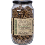 Mindful Foods 400g glass jar of organic activated walnuts with a green botanical label on a white background.