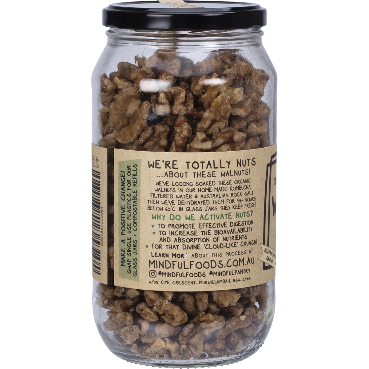 Mindful Foods 400g glass jar of organic activated walnuts with a green botanical label on a white background.