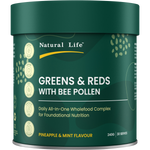 A dark green cylindrical canister of Natural Life Greens & Reds with Bee Pollen, Pineapple & Mint Flavour, on a plain white background.