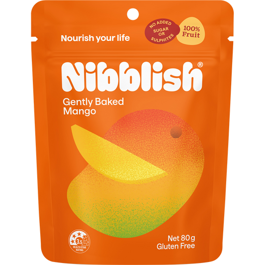 80g bag of Nibblish Gently Baked Mango on a white background with tropical leaf and whole mango illustrations.