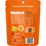 Back of a 80g bag of Nibblish Gently Baked Mango featuring nutritional information and ingredients on a white background.
