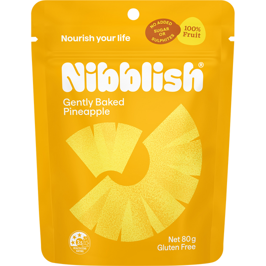80g bag of Nibblish Gently Baked Pineapple chunks, featuring a yellow and white package with a pineapple illustration.