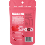 The back of a red Nibblish Gently Baked Strawberry bag showing nutritional information and a barcode.