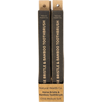 Two boxed horse bristle and bamboo toothbrushes from Natural Health Co. standing upright against a plain white background.