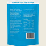 Back of a blue package with text and nutrition information on a beige background