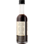 Side view of Natural Vanilla Company Traditional Vanilla Extract 50ml bottle with a brown and white label.
