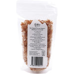 Nirvana Organics 250g resealable pouch of pink Himalayan salt granules on a white background.