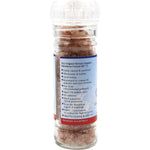 Nirvana Organics 125g glass salt grinder with pink Himalayan granules, shown at a slight angle on a white background.